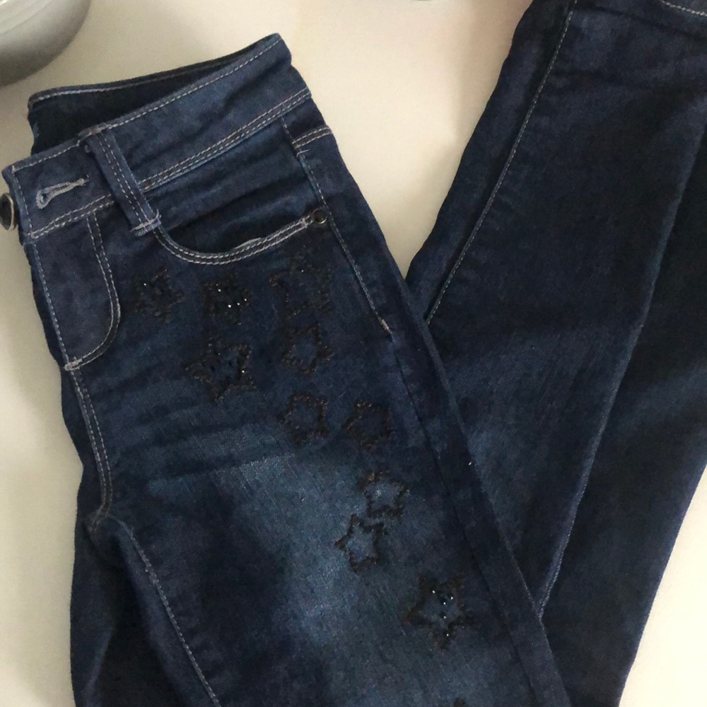 Slightly distressed girls’ jeans